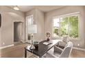 Bright office space featuring a large window with backyard views and a cozy sitting area at 1928 W 67Th Pl, Denver, CO 80221