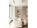 Bright living room featuring neutral tones, cozy seating, and modern shelving at 1133 14Th St # 1850, Denver, CO 80202