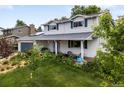 Beautiful two-story home features a well-maintained lawn and solar panels, with a spacious two-car garage at 915 Mercury Cir, Littleton, CO 80124