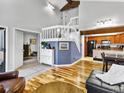 Open living room with hardwood floors, high ceilings and a loft at 2685 S Dayton Way # 292, Denver, CO 80231