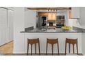 Well-equipped kitchen features a breakfast bar, stainless steel appliances, and granite countertops at 14100 E Temple Dr # W04, Aurora, CO 80015