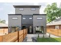 Contemporary home featuring a fenced backyard with a patio and fresh lawn at 4481 Raleigh St, Denver, CO 80211