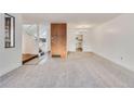 Open concept dining room with wood flooring and kitchen views at 1050 S Monaco Pkwy # 77, Denver, CO 80224