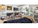 Cozy living room featuring a fireplace, comfortable seating, and stylish decor, creating a relaxing atmosphere at 16046 E Ithaca Pl # C, Aurora, CO 80013