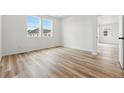 Bright bedroom featuring sleek floors and sunlit windows offering great natural light at 3431 N Denali St, Aurora, CO 80019
