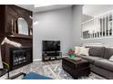 Inviting living room with fireplace, comfortable seating, and abundant natural light at 3082 W 107Th Pl # H, Westminster, CO 80031