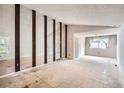 Spacious living room featuring a mirrored wall and large windows at 11029 W 65Th Way, Arvada, CO 80004