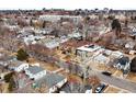 Suburban neighborhood with tree lined streets and various styles of single-Gathering homes at 2454 S Gilpin St, Denver, CO 80210