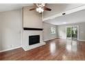Bright living room featuring a fireplace and hardwood floors, perfect for gatherings at 8056 Meadowdale Sq, Niwot, CO 80503