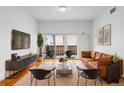 Modern living room features stylish decor, comfortable seating, and a bright airy ambiance at 1950 N Logan St # 601, Denver, CO 80203