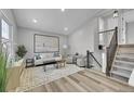 Bright living room with hardwood floors and modern furniture at 4663 S Buckley Way, Aurora, CO 80015