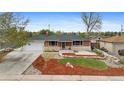 Charming brick home with a well-maintained front yard and inviting curb appeal at 1155 W 4Th Ave, Broomfield, CO 80020