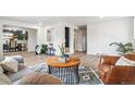 Inviting living room with hardwood floors, and open layout to dining room at 1155 W 4Th Ave, Broomfield, CO 80020