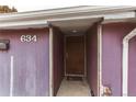 Close-up view of the home's front door showing the entrance and surrounding facade at 634 S Hazel Ct, Denver, CO 80219