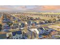 Panoramic aerial view of a residential neighborhood featuring well-maintained homes with solar panels and mountain views at 226 N Millbrook St, Aurora, CO 80018