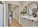 Inviting hallway featuring stylish decor, modern lighting, and smooth hardwood floors, adding elegance at 226 N Millbrook St, Aurora, CO 80018