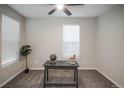 Neutral bedroom with carpet, fan, and natural light streaming in from the window at 17600 Rose Heath Ln, Parker, CO 80134
