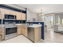 Modern kitchen with stainless steel appliances and an open layout at 5555 E Briarwood Ave # 1404, Centennial, CO 80122