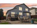 Spacious backyard featuring a large deck and outdoor dining area, perfect for entertaining guests at 15948 E 106Th Pl, Commerce City, CO 80022