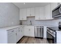 Well-appointed kitchen with stainless steel appliances and modern countertops at 14723 March Dr, Denver, CO 80239