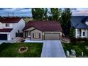 This charming home features a well-kept lawn, a convenient two-car garage, and classic architectural details at 5428 Suffolk Ave, Castle Rock, CO 80104