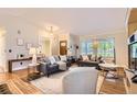 Bright living room featuring hardwood floors and comfortable seating at 702 Windmill Pl, Highlands Ranch, CO 80126