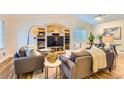 Inviting living room with built-in shelving and neutral decor at 702 Windmill Pl, Highlands Ranch, CO 80126