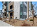 Modern apartment building with mixed materials and textures, with a gravel landscape and minimal plantings at 9287 Twenty Mile Rd # 108, Parker, CO 80134