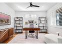 Modern home office with hardwood floors, white walls, natural light and sophisticated decor at 5086 N Raleigh St, Denver, CO 80212