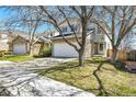 Street view of an attractive two-story house with a stone facade and well-maintained lawn at 8050 Bryant St, Westminster, CO 80031