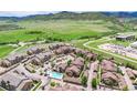 Expansive aerial view of the community with lush green landscape and mountain views at 10056 W Unser Dr # 106, Littleton, CO 80127