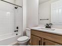 Well-lit bathroom features modern fixtures, a bathtub with shower, and a vanity with solid surface counters at 25041 E 38Th Ave, Aurora, CO 80019