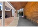 Covered patio with brick flooring and wooden accents at 9696 E Sand Lily Ln, Parker, CO 80134