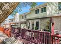 Townhome back patio featuring wood deck and privacy wall at 5252 W 68Th Ave, Arvada, CO 80003