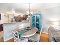 Charming dining area features hardwood floors, stylish furnishings and easy access to the kitchen at 5252 W 68Th Ave, Arvada, CO 80003