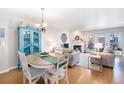 Inviting, open-concept living space with fireplace, dining area, and comfortable seating at 5252 W 68Th Ave, Arvada, CO 80003