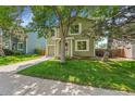 View of the home and yard, showcasing the property's exterior, landscaping, and overall curb appeal in a neighborhood setting at 4267 W Kenyon Ave, Denver, CO 80236