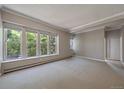 Spacious living room with large windows and neutral carpeting at 3233 Vallejo St # 3B, Denver, CO 80211