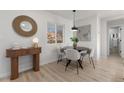 Bright dining room with modern table set and stylish decor at 4910 Alcott St, Denver, CO 80221