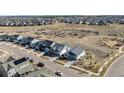 Neighborhood aerial view with homes and open space in the background at 22773 E Narrowleaf Cir, Aurora, CO 80016