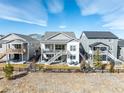 Back exterior view featuring a multi-level deck/patio space ideal for outdoor relaxation and entertaining in a modern setting at 22773 E Narrowleaf Cir, Aurora, CO 80016