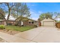 A cozy home with a detached garage and spacious driveway, perfect for a Gathering at 1327 E 108Th Pl, Northglenn, CO 80233