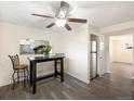 Small dining area with breakfast bar and view into kitchen at 9250 E Girard Ave # 8, Denver, CO 80231