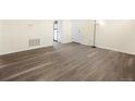 Spacious living room featuring light grey laminate flooring at 9250 E Girard Ave # 8, Denver, CO 80231