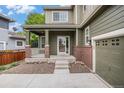 Charming front porch with brick accents provides a welcoming entrance to the home at 3389 Willowrun Dr, Castle Rock, CO 80109