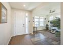 Bright foyer with hardwood floors, an office space, and a welcoming entryway creating an inviting first impression at 17788 Olive St, Broomfield, CO 80023