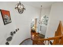 Elegant foyer with curved staircase, high ceilings, and decorative lighting, creating a grand entrance at 10908 Eagle Run Dr, Parker, CO 80138