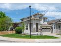 Charming two-story home with stone accents and a well-maintained front yard at 10685 Cherrybrook Cir, Highlands Ranch, CO 80126