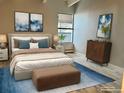 Cozy bedroom showcasing a comfortable bed, stylish decor, and bright natural light at 1011 S Ironton St # 107, Aurora, CO 80012