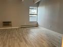 Empty bedroom provides ample space and natural light from a large window at 1011 S Ironton St # 107, Aurora, CO 80012